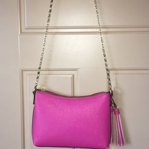 A pink shoulder purse